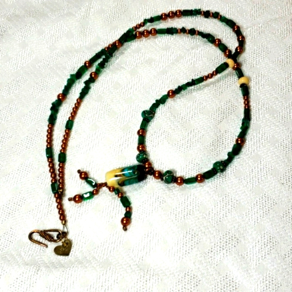 Long green and copper beaded necklace